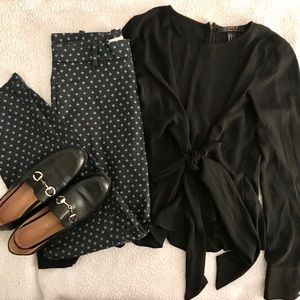 Black blouse, blue patterned pants